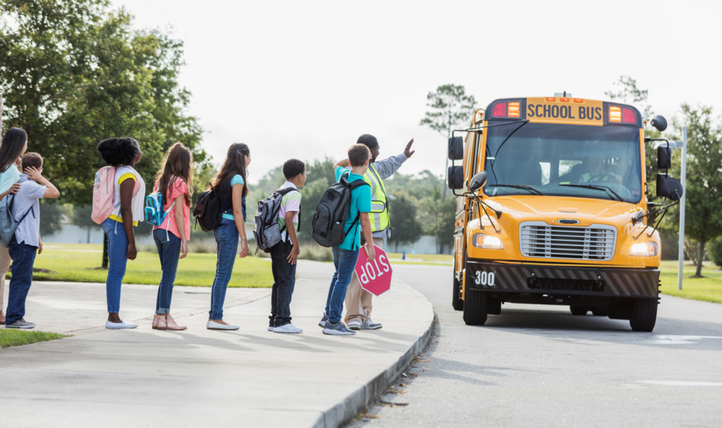 students waiting for school bus