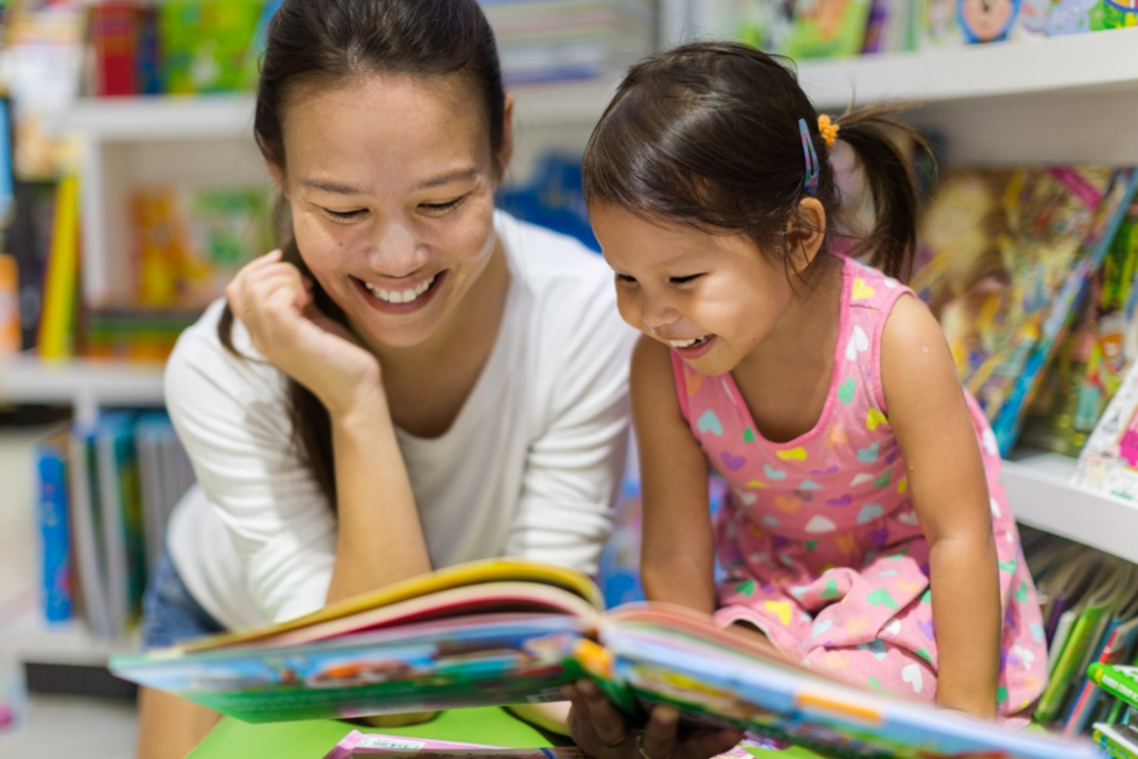 happy girls reading in school library