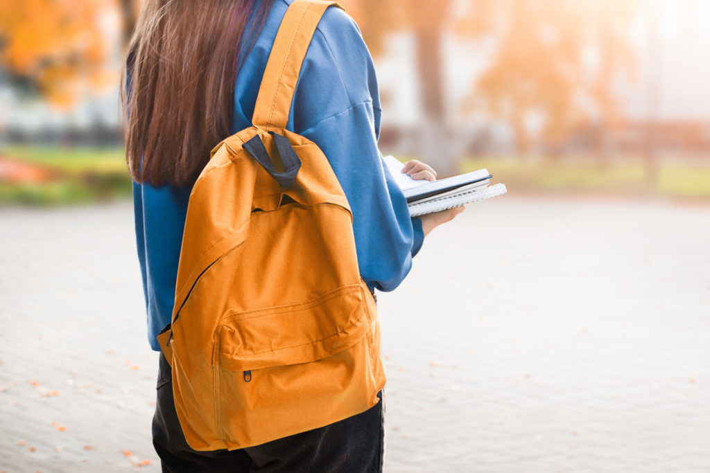 back view of girl with backpack