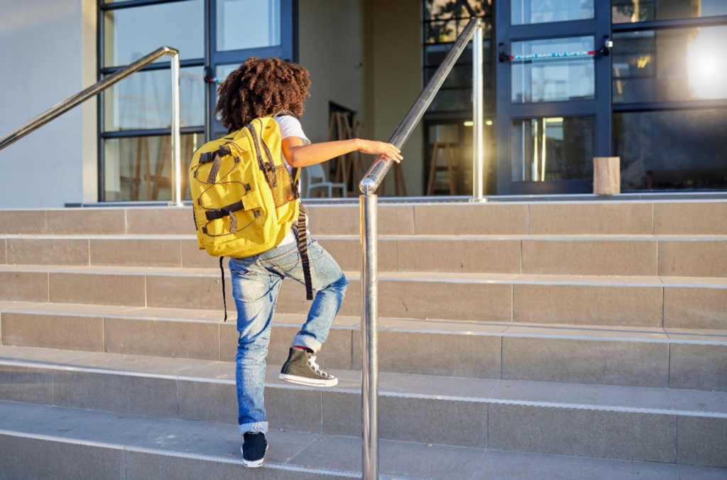 girl climbing school steps